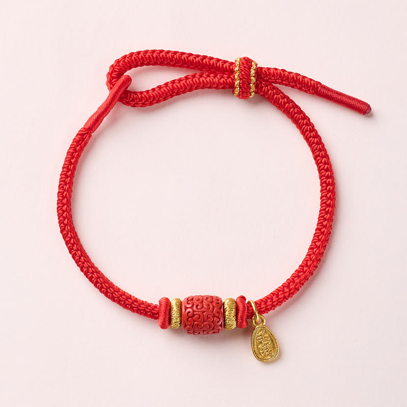 Fu Character Luck Bracelet – braided red cord with cloud-pattern bead and gold fortune charm, flat lay, Chinese cultural bracelet