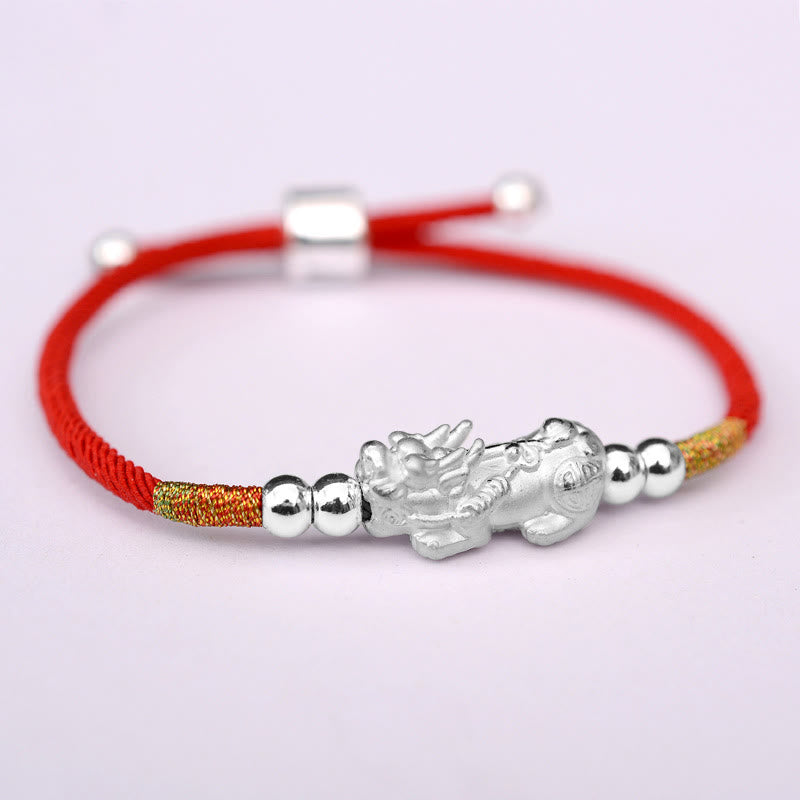Gold-Plated PiXiu Red String Bracelet – silver PiXiu charm on red cord with gold thread accents, white background