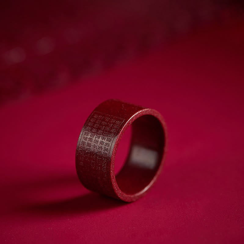 Cinnabar Heart Sutra Om Mani Padme Hum Blessing Ring – deep red band with engraved text on crimson velvet, cinnabar ring Main image