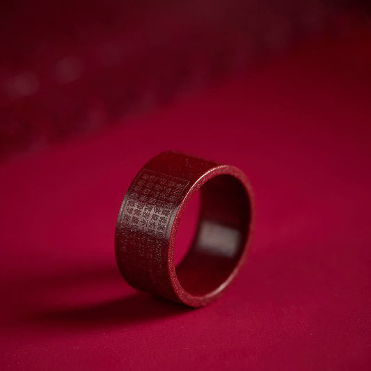 Cinnabar Heart Sutra Om Mani Padme Hum Blessing Ring – deep red band with engraved text on crimson velvet, cinnabar ring
