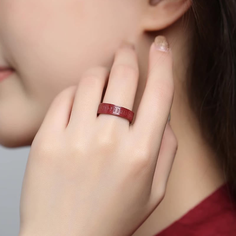 Cinnabar Heart Sutra Om Mani Padme Hum Blessing Ring – lifestyle close-up with hand near face showing red band, blessing ring