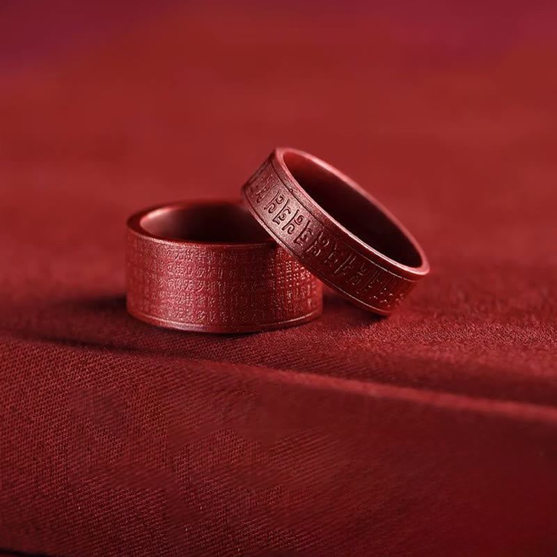 Cinnabar Heart Sutra Om Mani Padme Hum Blessing Ring – two interlocking red rings showing interior and engraved exterior, sutra ring