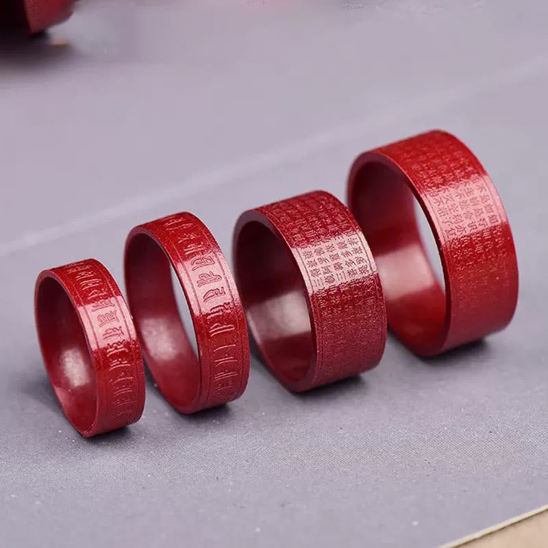 Cinnabar Heart Sutra Om Mani Padme Hum Blessing Ring – four rings in graduated sizes on gray surface, cinnabar band ring