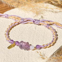 Natural Amethyst Balance Lucky Bracelet – light stone dried grass background, natural amethyst beads