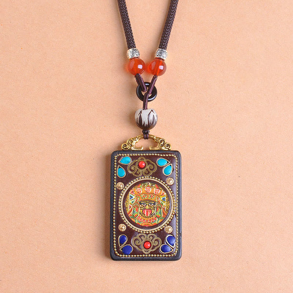 Zakiram Yin Yang Ebony Wood Pendant – centered on peach, gold-tone thangka jewelry