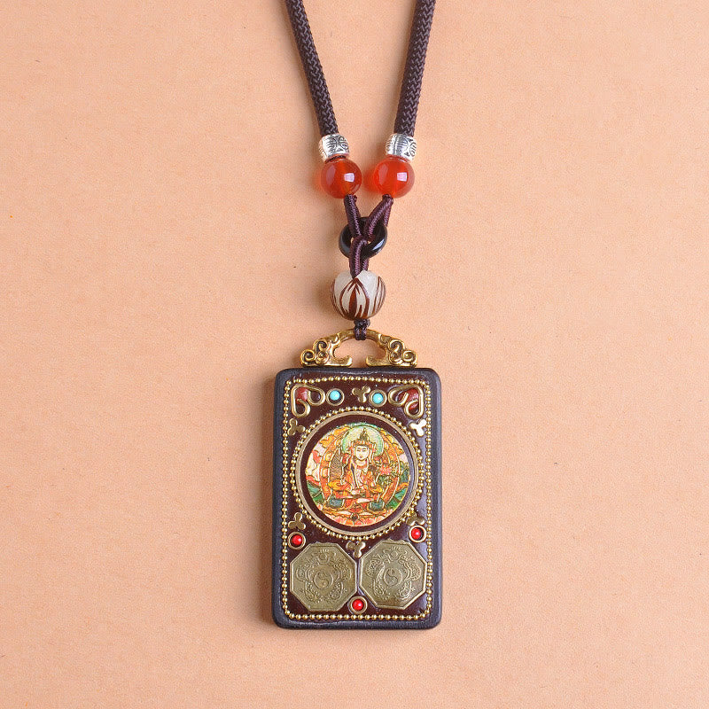 Zakiram Yin Yang Ebony Wood Pendant – front view on peach, Green Tara bodhisattva