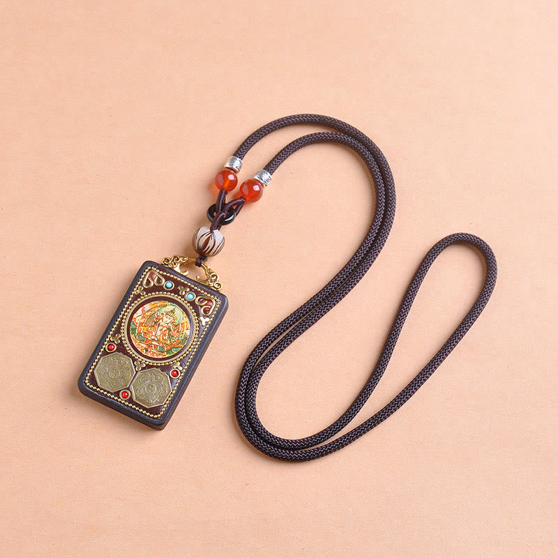 Zakiram Yin Yang Ebony Wood Pendant – flat lay diagonal, turquoise coral talisman