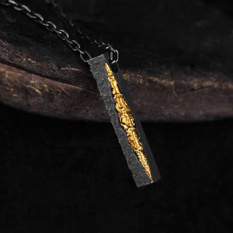 Om Mani Padme Hum Necklace – blackened silver pendant with gold vein inlay on dark oxidized chain, three-quarter angle, artisan necklace