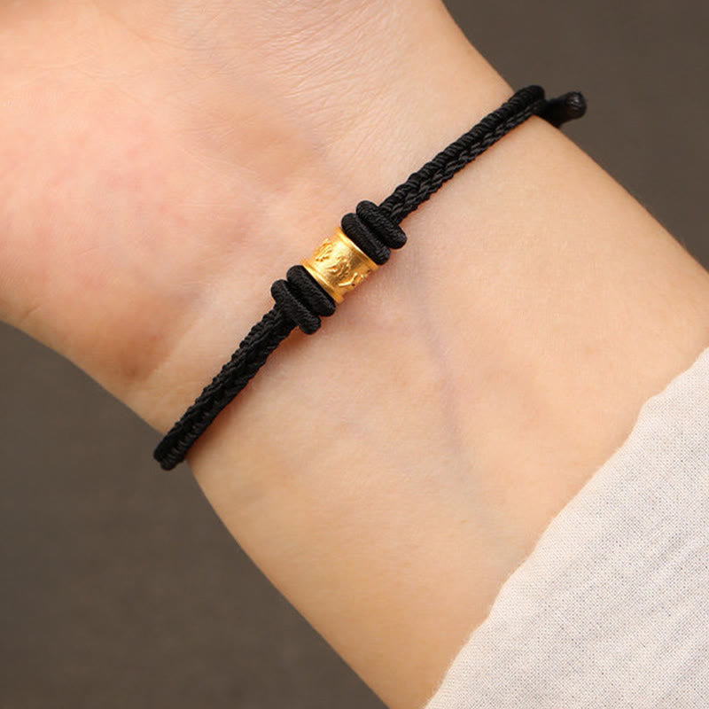 999 Gold Om Mani Padme Hum Red String Bracelet – two 999 pure gold cylinder beads with carved patterns, 999 gold bead