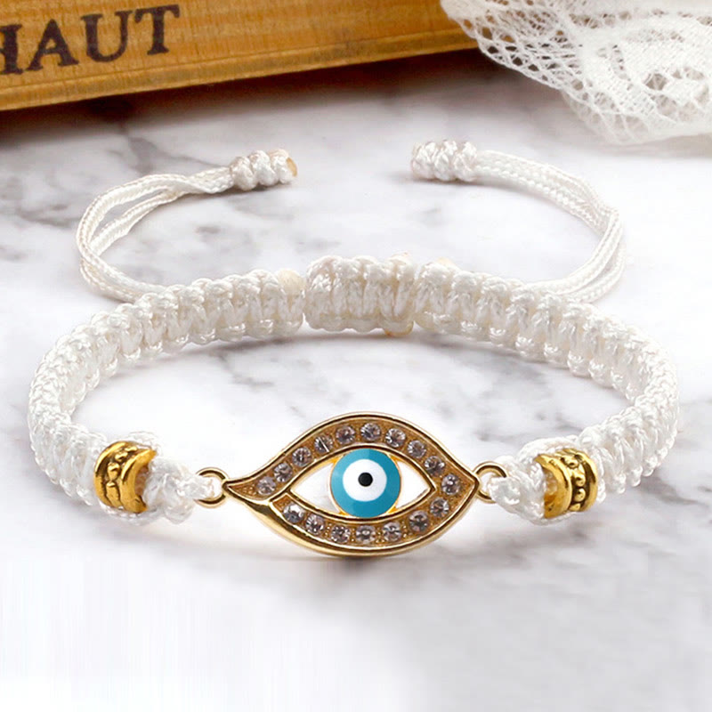 White cord evil eye bracelet with gold blue evil eye crystal charm, marble styling