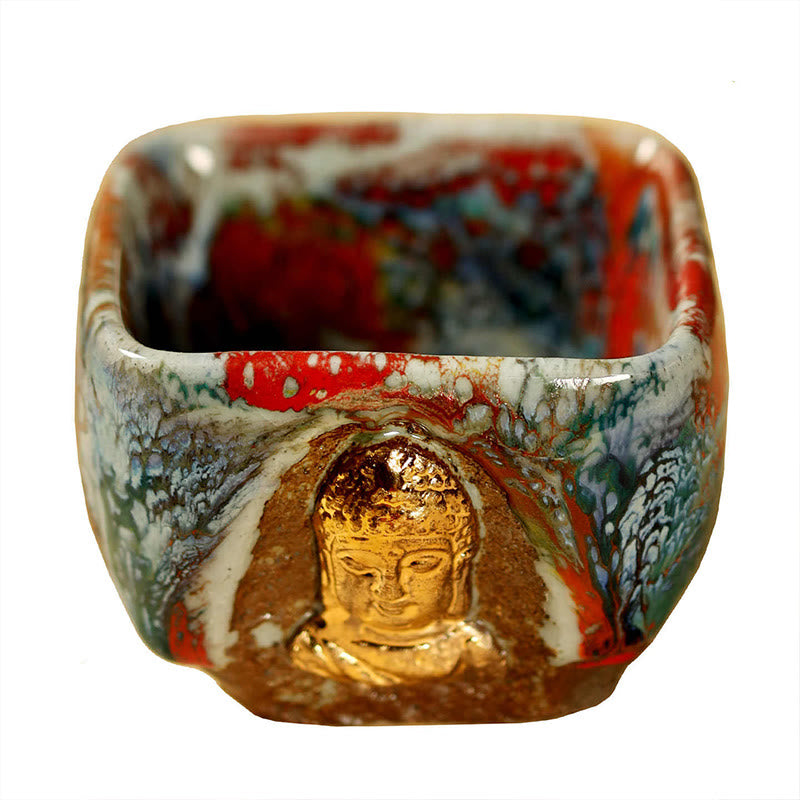 Hand-painted Dunhuang Meditating Buddha Shino Ceramic Teacup – cup sitting on stone tea board, natural wabi sabi aesthetic