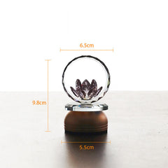 Crystal sphere with laser-etched lotus on bronze pedestal, lotus decoration