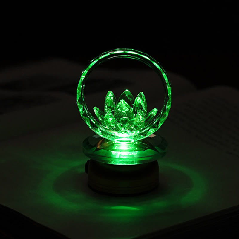 Green LED crystal lotus ring lamp on dark surface, color-changing lotus light