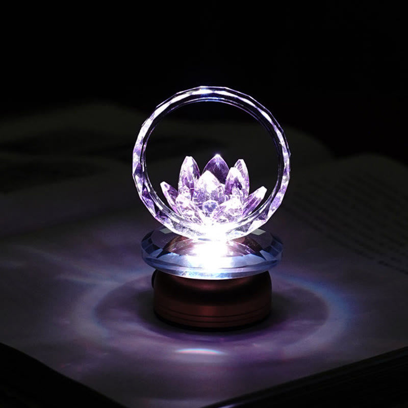 Purple-blue crystal lotus ring lamp on dark surface, LED lotus night light