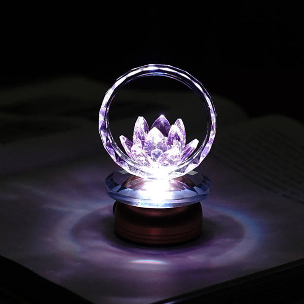 Purple-blue crystal lotus ring lamp on dark surface, LED lotus night light