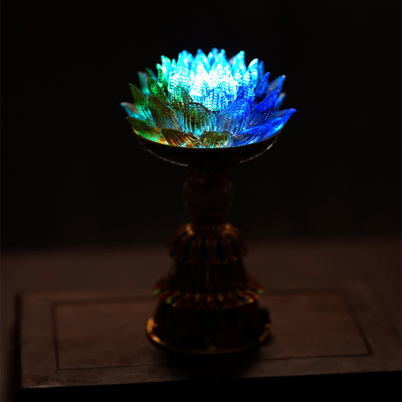 Lotus Liuli Glass Decor - aqua blue glass lotus candle holder with gold cloisonne enamel pedestal on open book, Tibetan decor