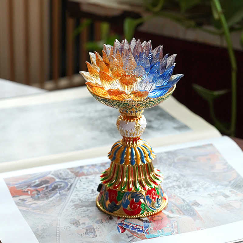 Lotus Liuli Glass Decor - amber and blue crystal lotus lamp with antique bronze base, glowing internal light on dark surface