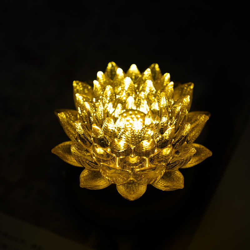 Lotus Liuli Lamp – golden bloom against black background, lotus glass decoration