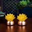 Pair of lotus liuli glass decorations on dark wood, copper base, liuli ornament