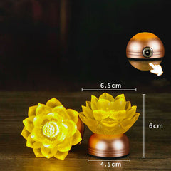 Two lotus LED lamps one upright one sideways on dark wood, liuli glass lamp