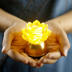 Lotus Liuli Glass Decoration held in hands glowing golden, liuli decor