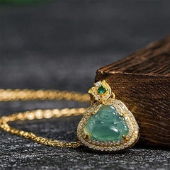 Jade Laughing Buddha Prosperity Necklace Pendant – close-up of laughing buddha face detail, healing crystal necklace