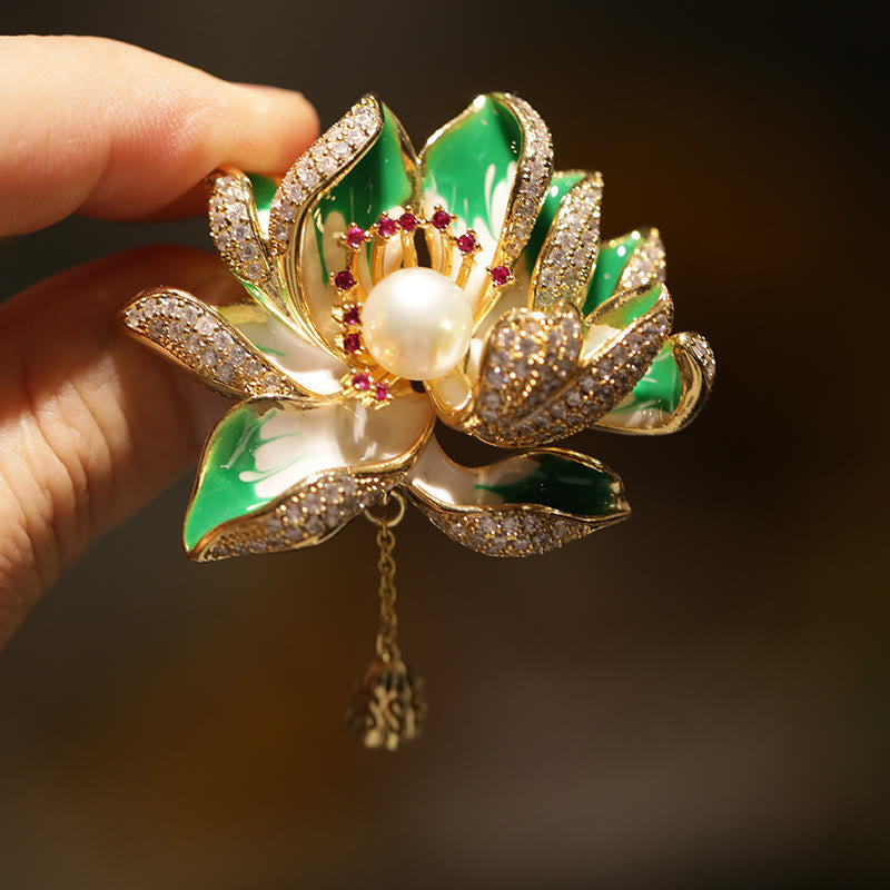 Lotus Flower Pearl Copper Brooch – hand-held showing scale, gold-tone lotus with pink gem accents, statement brooch