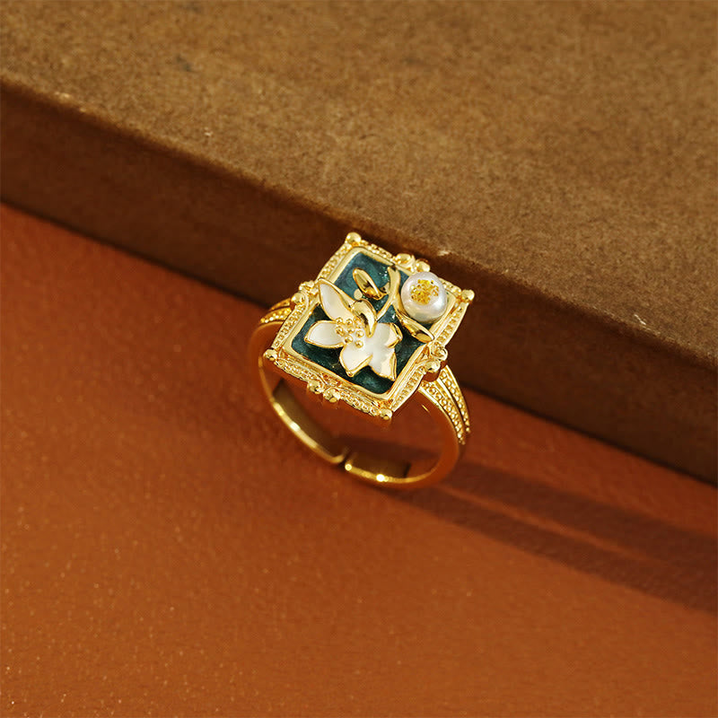 Vintage Lotus Pearl Copper Ring – angled on kraft paper, green enamel with ivory lotus and pearl, artisan ring