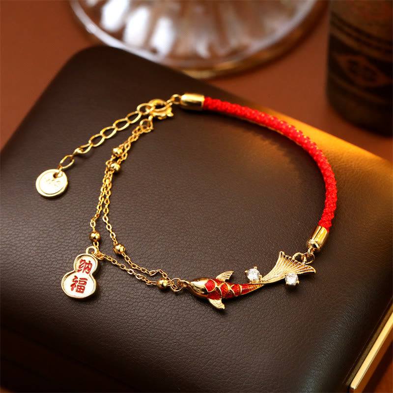 Koi Fish Wealth Gourd Red String Bracelet – bracelet worn on wrist showing red string and charm pendants