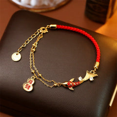 Koi Fish Wealth Gourd Red String Bracelet – red cord bracelet with koi and gourd charms on festive background