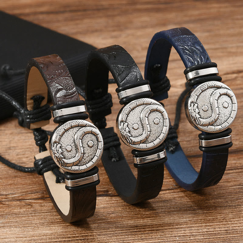 Leather Yin Yang Dragon Bracelet – three color variants brown black navy on rustic wood surface, Balance