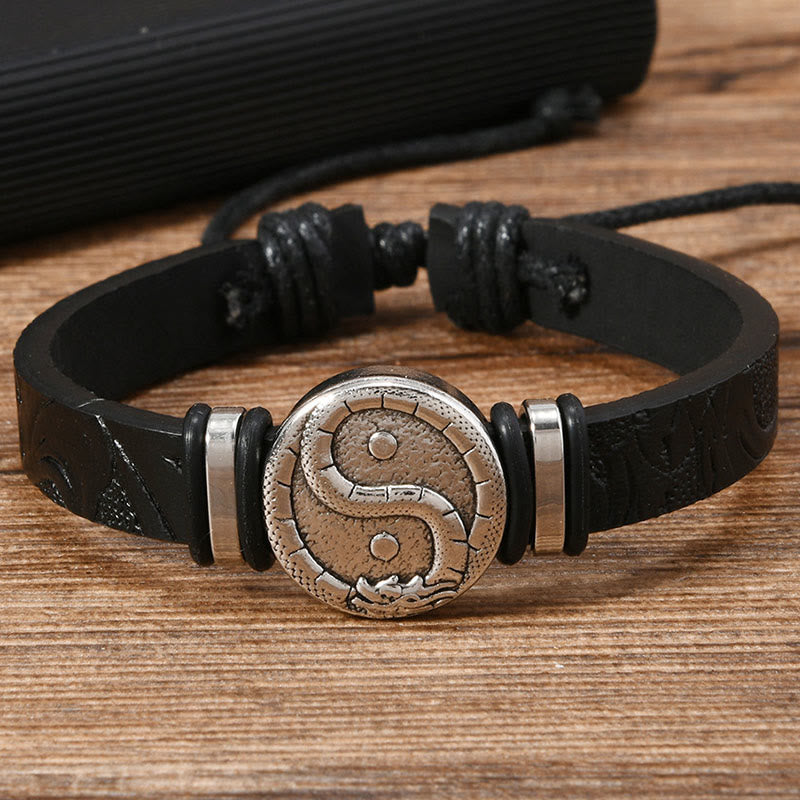 Leather Yin Yang Dragon Bracelet – dark leather band on wood with oxidized yin yang dragon charm, Balance