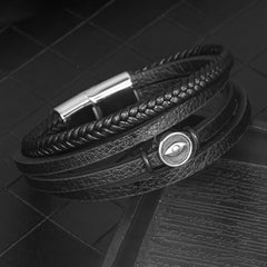 Leather Balance Bracelet – Multi-strand black leather with gunmetal eye medallion on dark stone