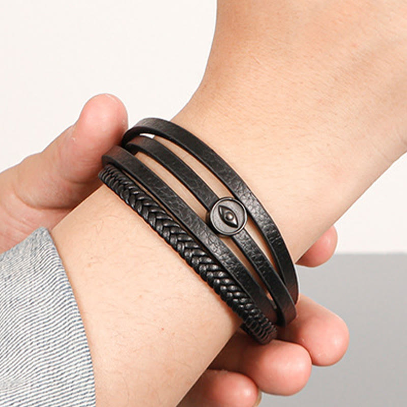 Braided Leather Bracelet – Four-strand black leather with eye charm on wrist, heather gray cuff