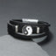 Yin Yang Leather Balance Bracelet – black leather layered bracelet with silver yin-yang charm on dark stone, leather bracelet