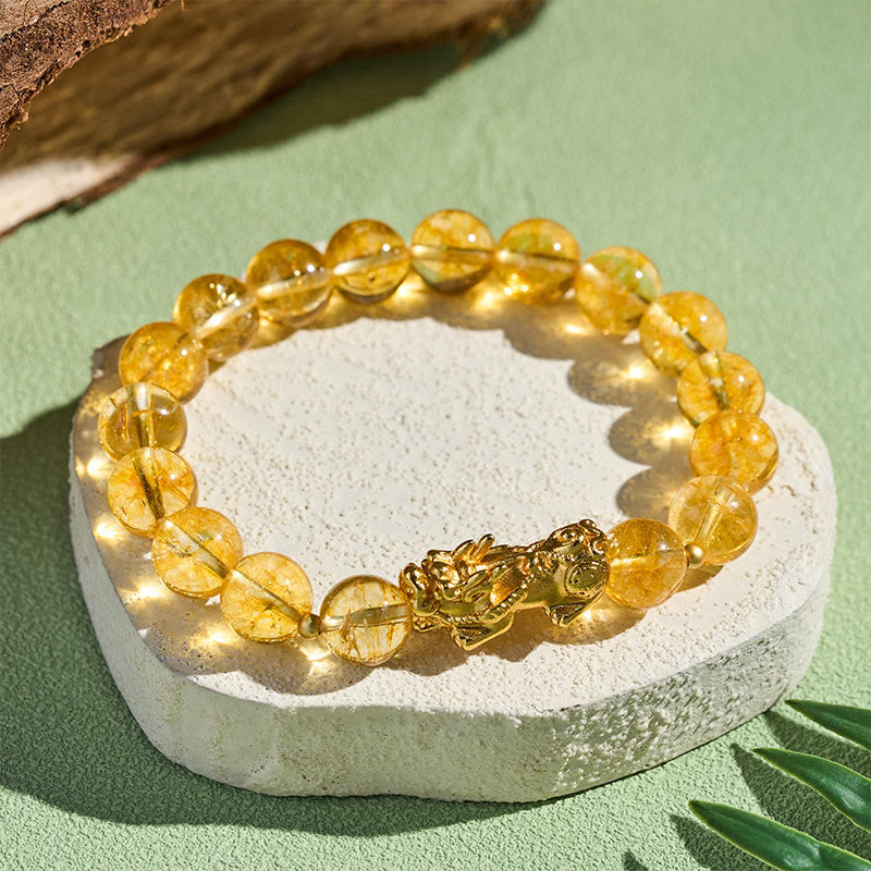 Natural Citrine Pixiu Prosperity Protection Bracelet - 10mm – Bracelet on white stone green background, 10mm beads