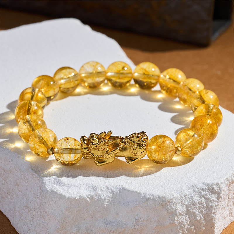 Natural Citrine Pixiu Prosperity Protection Bracelet - 10mm – Side angle on white stone brown bg, citrine beads