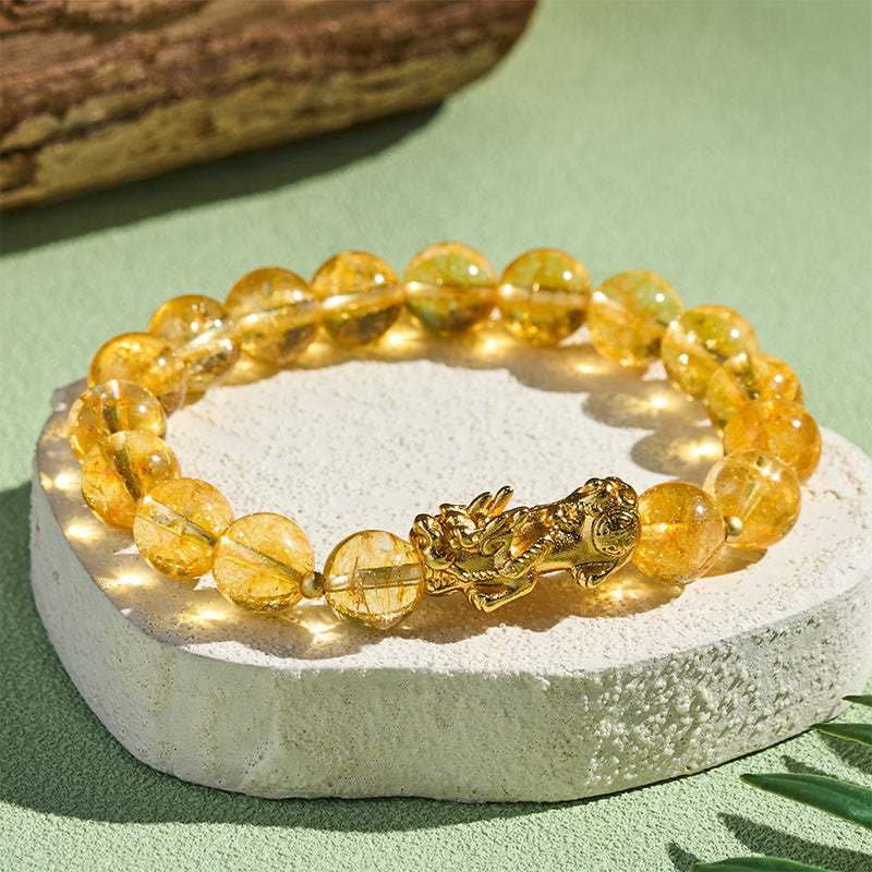 Natural Citrine Pixiu Prosperity Protection Bracelet - 10mm – Bracelet on white stone green bg, golden Pixiu charm