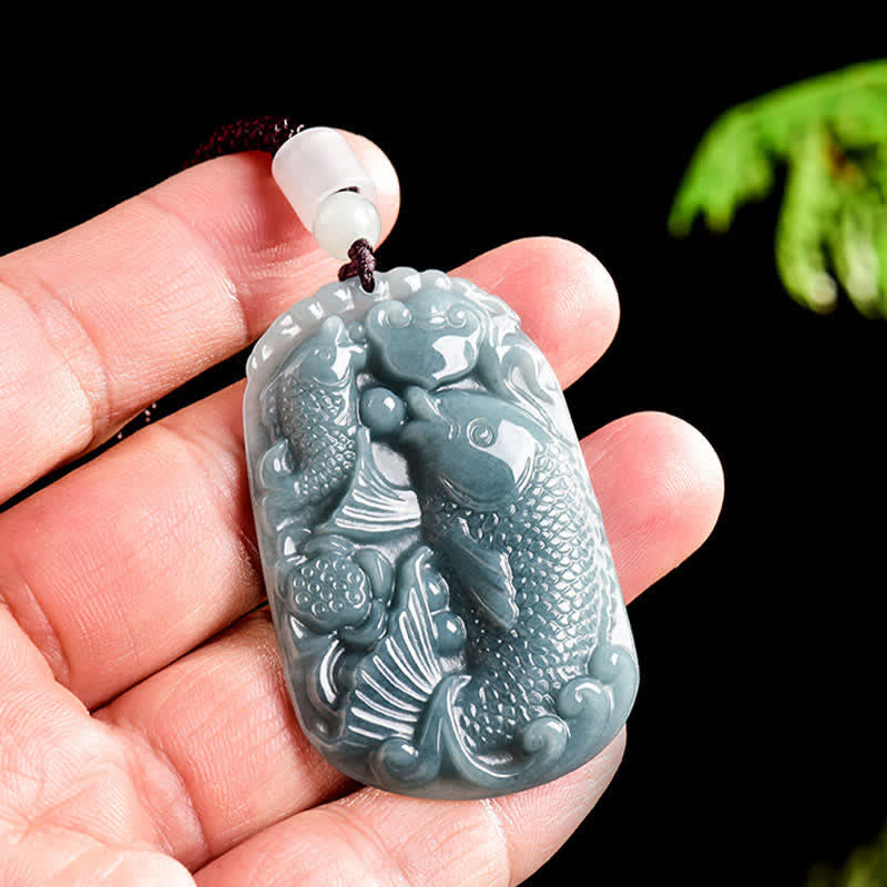 Natural Jade Double Koi Fish Necklace – side angle showing pendant depth and jade translucency in natural light