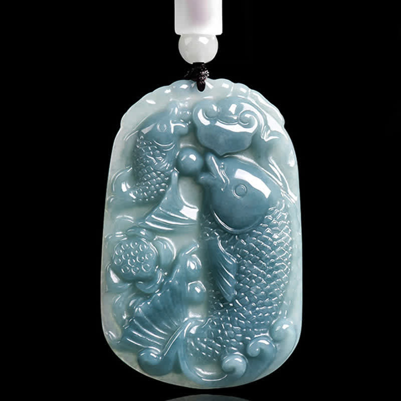 Natural Jade Double Koi Fish Necklace – close-up of hand-carved jade koi fish showing smooth polished stone texture