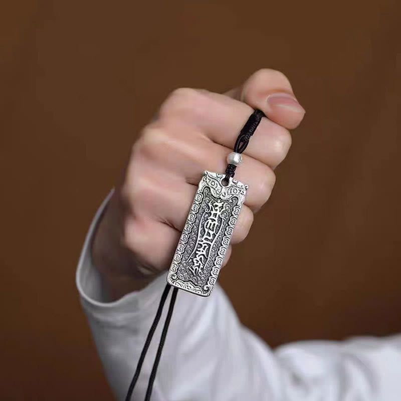 Namo Amitabha Copper Rope Necklace - Hand-held pendant showing engraved talisman text, spiritual jewelry