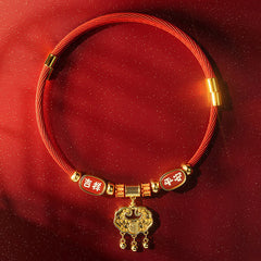 Red String Bead Fu Pet Collar – top-down flat lay, red cord with gold fu lock, jixiang ping'an plates, gold glitter
