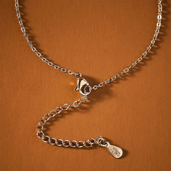 Koi Fish Peace Buckle Necklace – macro chain clasp and extender detail, 925 stamp, on terracotta surface