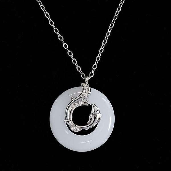 Koi Fish Peace Buckle Necklace – jade ping an kou disc with silver fish overlay, crystals, on pure black background