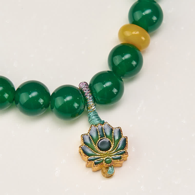 Green Agate Lotus Charm Beaded Bracelet - Macro close-up of metallic wrapped knot and cloisonne lotus detail, artisan jewelry