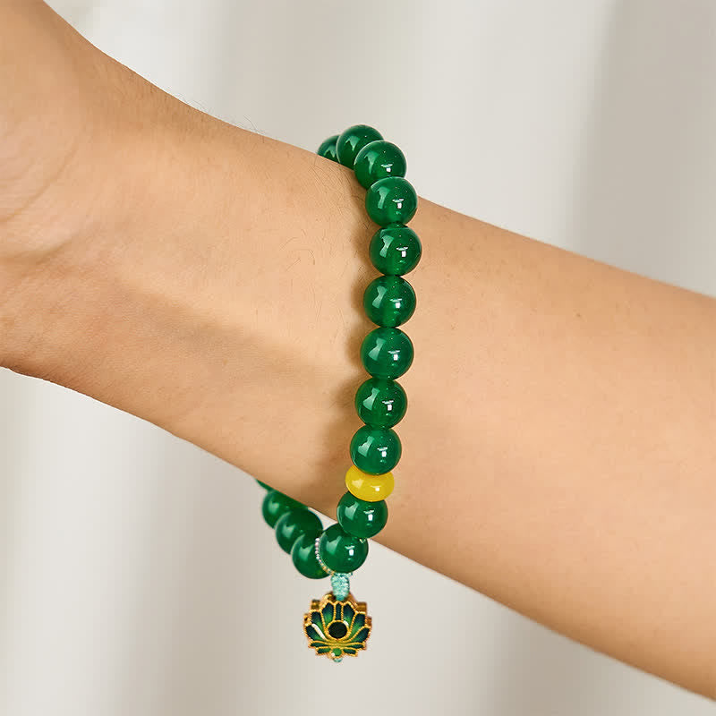 Green Agate Lotus Charm Beaded Bracelet - Side wrist view showing enamel lotus focal and turquoise cord, natural agate