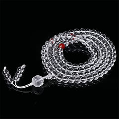 Liuli Lotus 108 Bead Mala - 45-degree coiled view on black background, crystal prayer beads