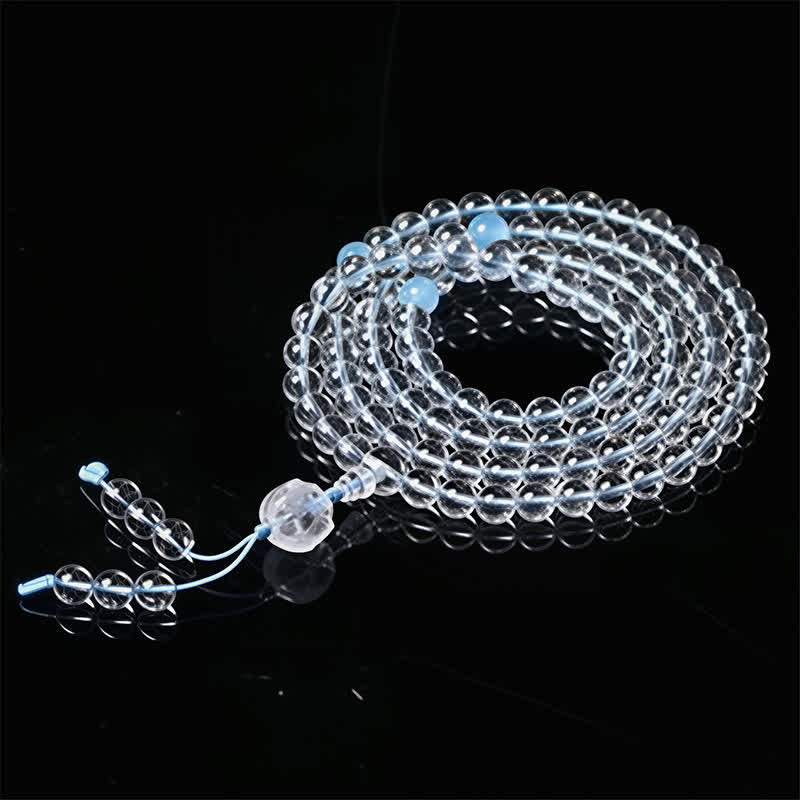 Liuli Lotus 108 Bead Mala - close coil showing blue spacer beads and faceted guru bead detail