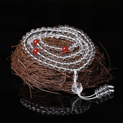 Liuli Lotus 108 Bead Mala - coiled on twig nest with red marker beads, clear crystal meditation necklace