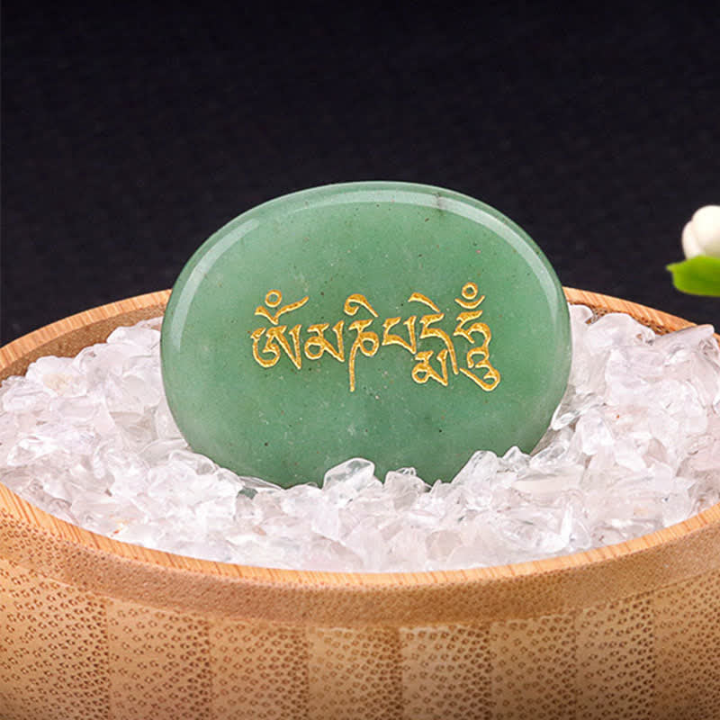 Om Mani Padme Hum Palm Stone – Green aventurine with gold Tibetan text in crystal bed